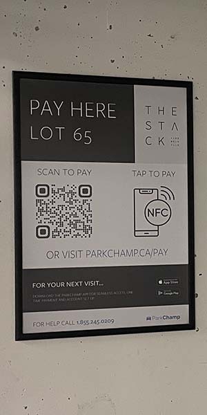 ParkChamp banner with lot id, QR code and NFC chip which allow to pay for parking
